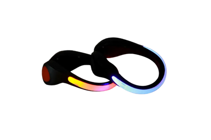 Pair of black clip-on LED shoe lights glowing red-orange and blue, shown on a white background