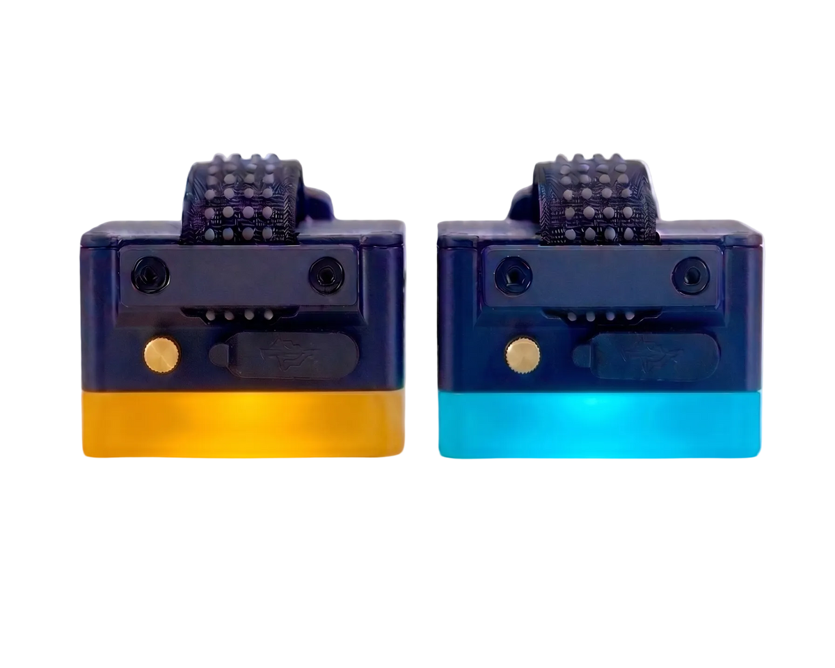 Two black strap-on LED light units glowing amber and cyan, front view