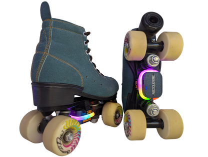 Pair of SK8Lytz HALOZ heel-mounted LED units, dark gray with orange lettering, white light ring and USB-C port